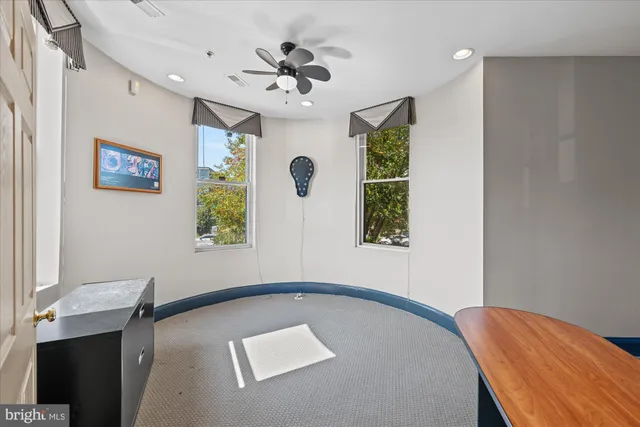 a view of a workspace with furniture