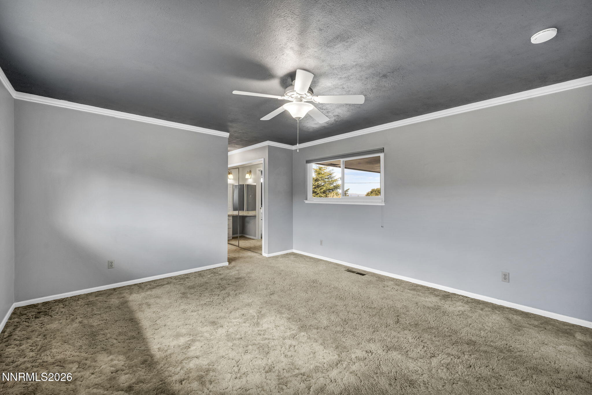 14190 Rim Rock Drive Reno, NV 89521 - Photo 31 of 68 an empty room with windows and fan