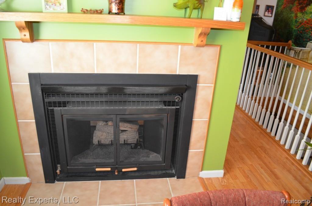 12749 Tuttle Hill Road Willis, MI 48191 - Photo 5 of 15 DOUBLE SIDED FIREPLACE
