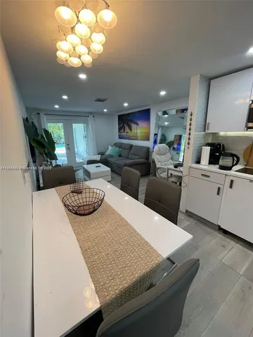 a kitchen with stainless steel appliances refrigerator stove microwave and cabinets