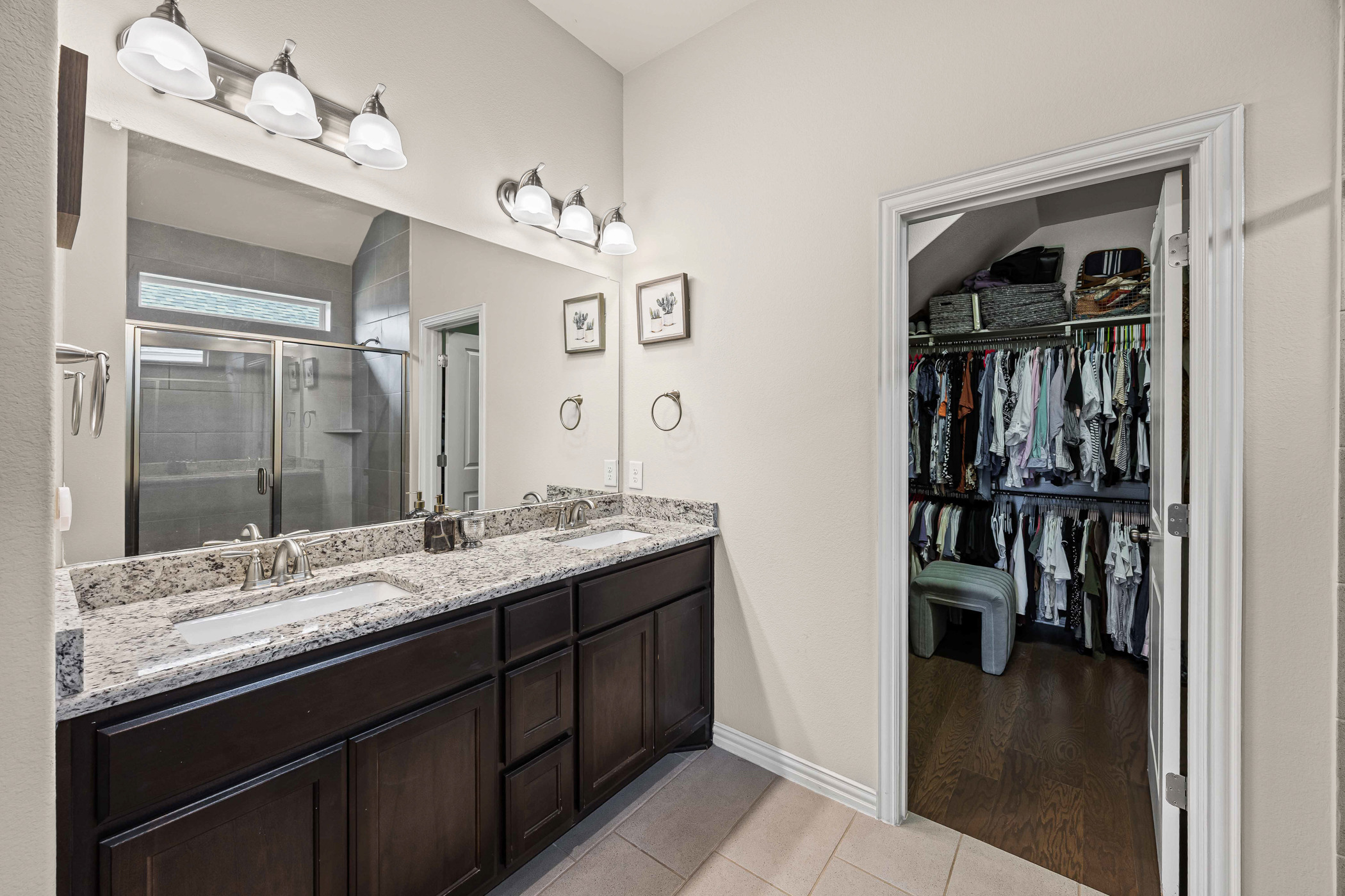 631 Turquoise Drive Dripping Springs, TX 78620 - Photo 14 of 23 Spa-inspired en-suite bath designed for relaxation and everyday comfort.