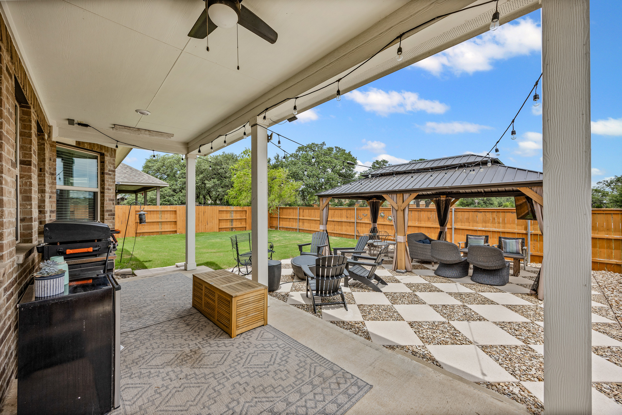 631 Turquoise Drive Dripping Springs, TX 78620 - Photo 21 of 23 Covered patio and pergola create a peaceful outdoor living and entertaining space.