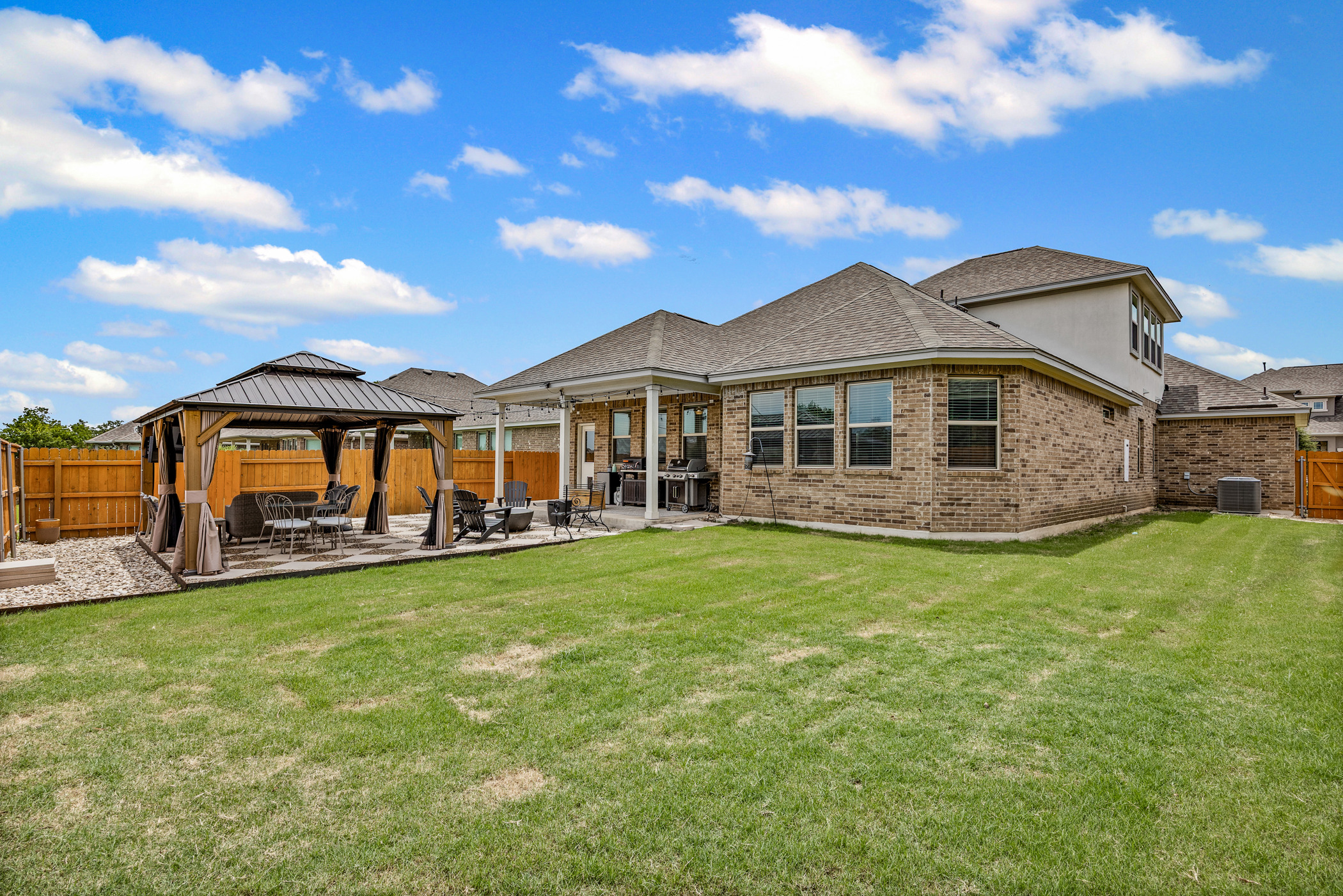 631 Turquoise Drive Dripping Springs, TX 78620 - Photo 22 of 23 Fully fenced backyard with room to relax, play, and enjoy the outdoors.