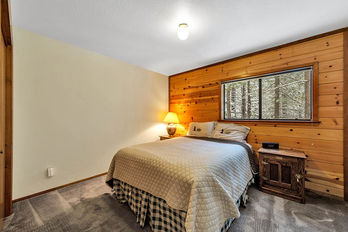 11780 Oslo Drive Truckee, CA 96161 - Photo 11 of 21 a bedroom with a bed and a flat tv screen on dresser