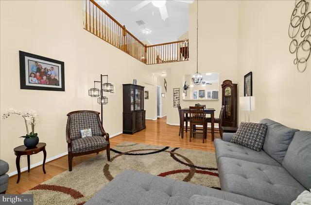 a view of staircase with wooden floor and white walls
