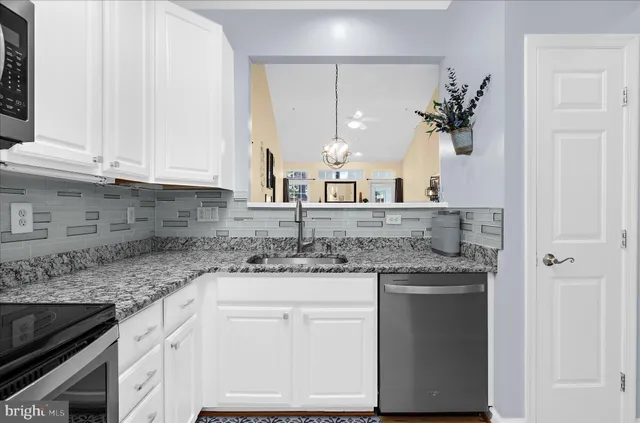 a view of a dining room with furniture wooden floor and a fireplace