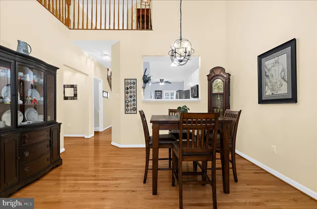 a living room with furniture and large windows