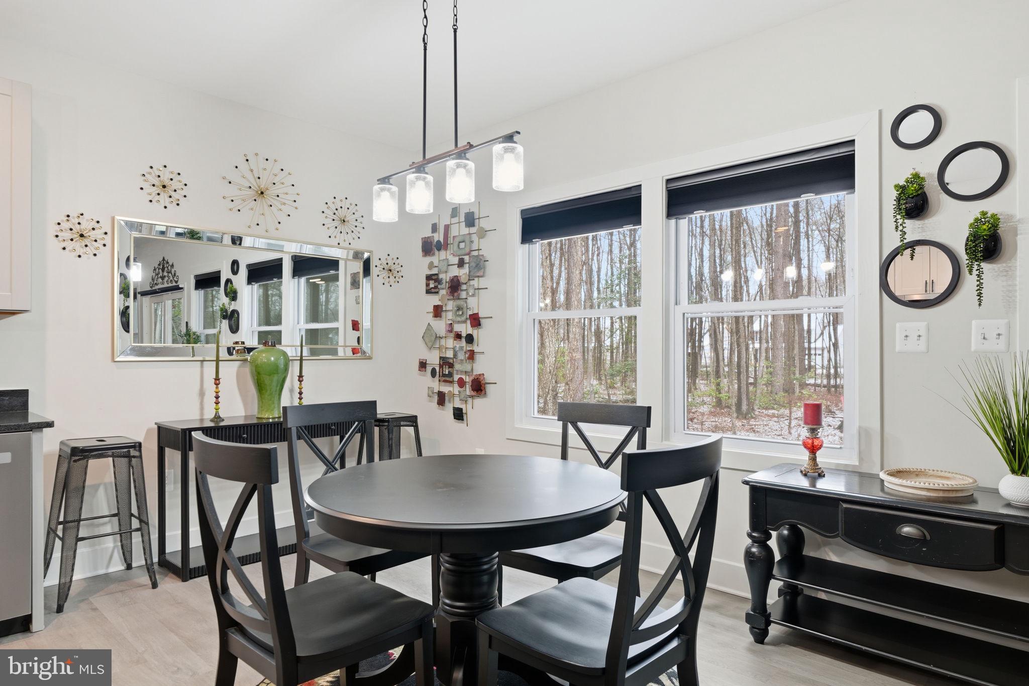 107 Pinewood Lane Colonial Beach, VA 22443 - Photo 14 of 25 a view of a dining room with furniture window and wooden floor