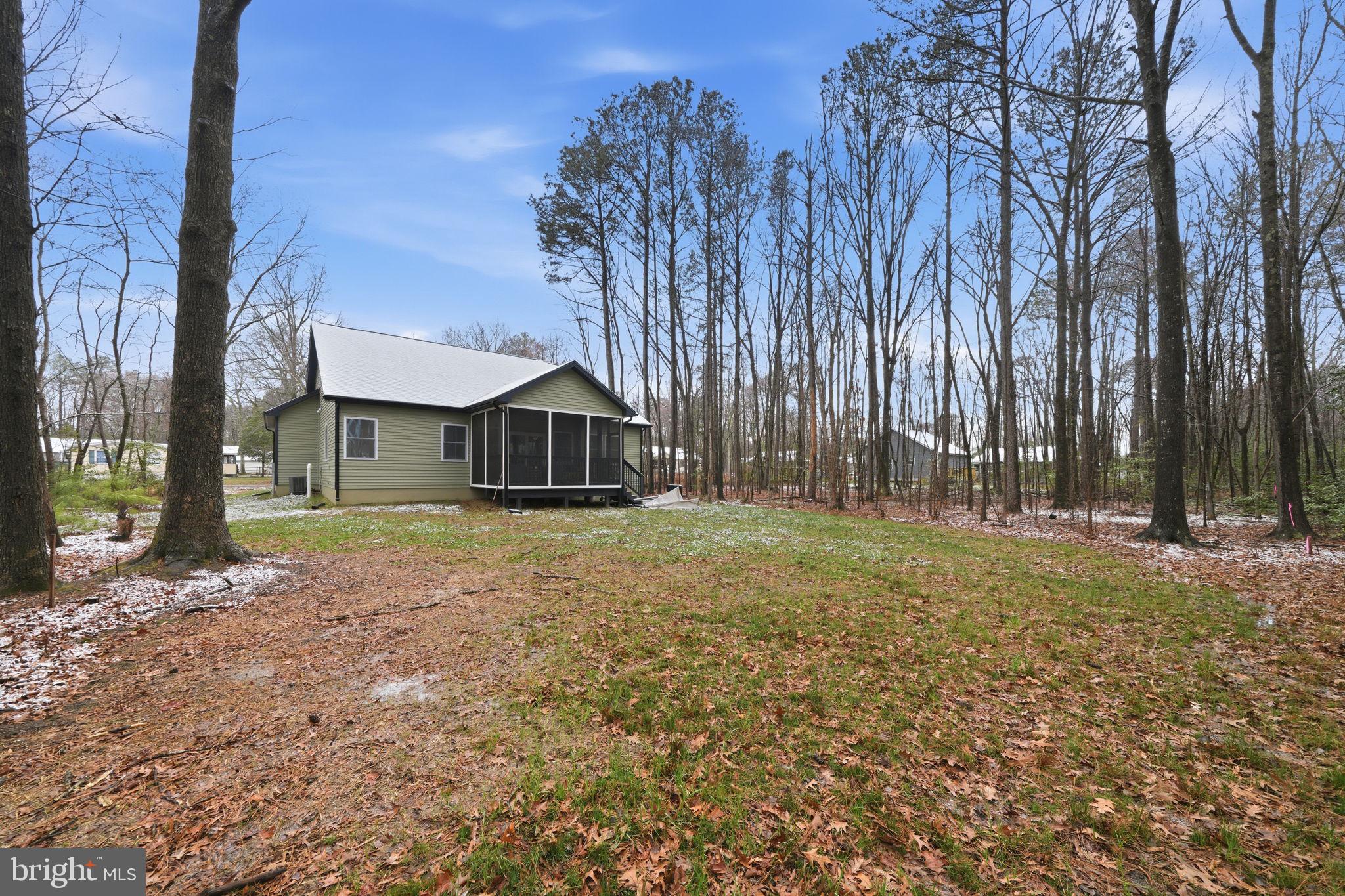 107 Pinewood Lane Colonial Beach, VA 22443 - Photo 23 of 25 a front view of a house with a yard