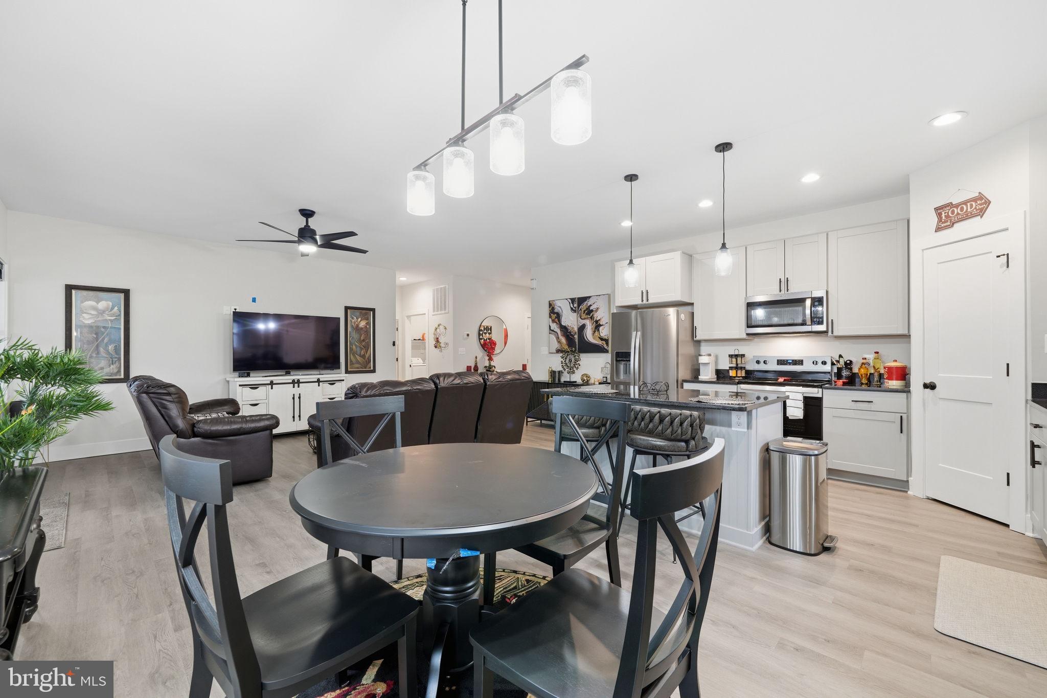 107 Pinewood Lane Colonial Beach, VA 22443 - Photo 8 of 25 a view of a dining room with furniture and wooden floor