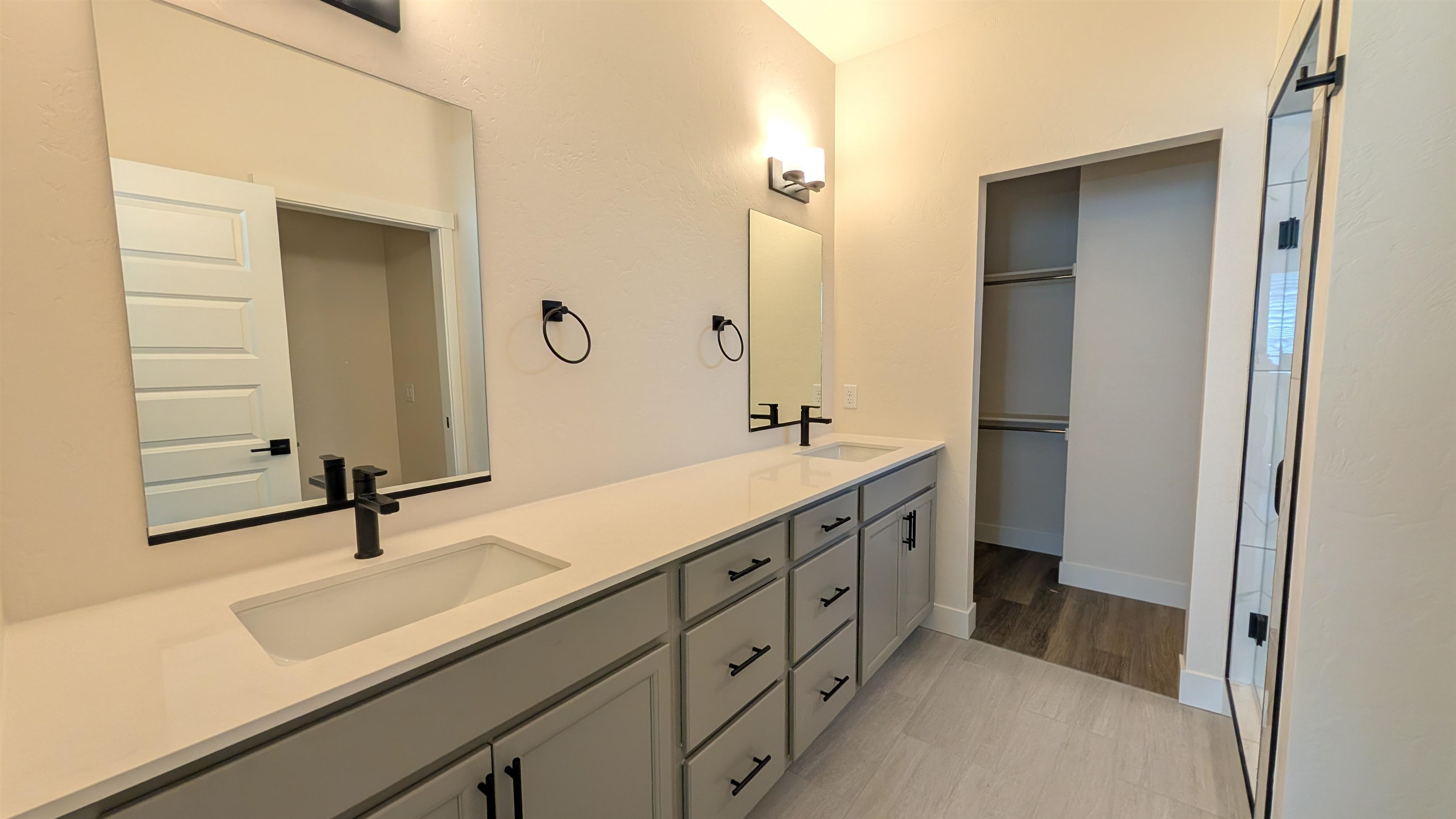 1660 Rusty Rivet Road Fruita, CO 81521 - Photo 10 of 15 a bathroom with a double vanity sink and mirror
