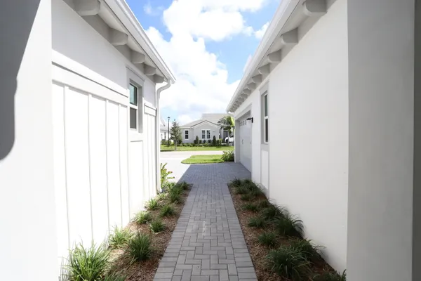 a view of a house with a yard and a garage