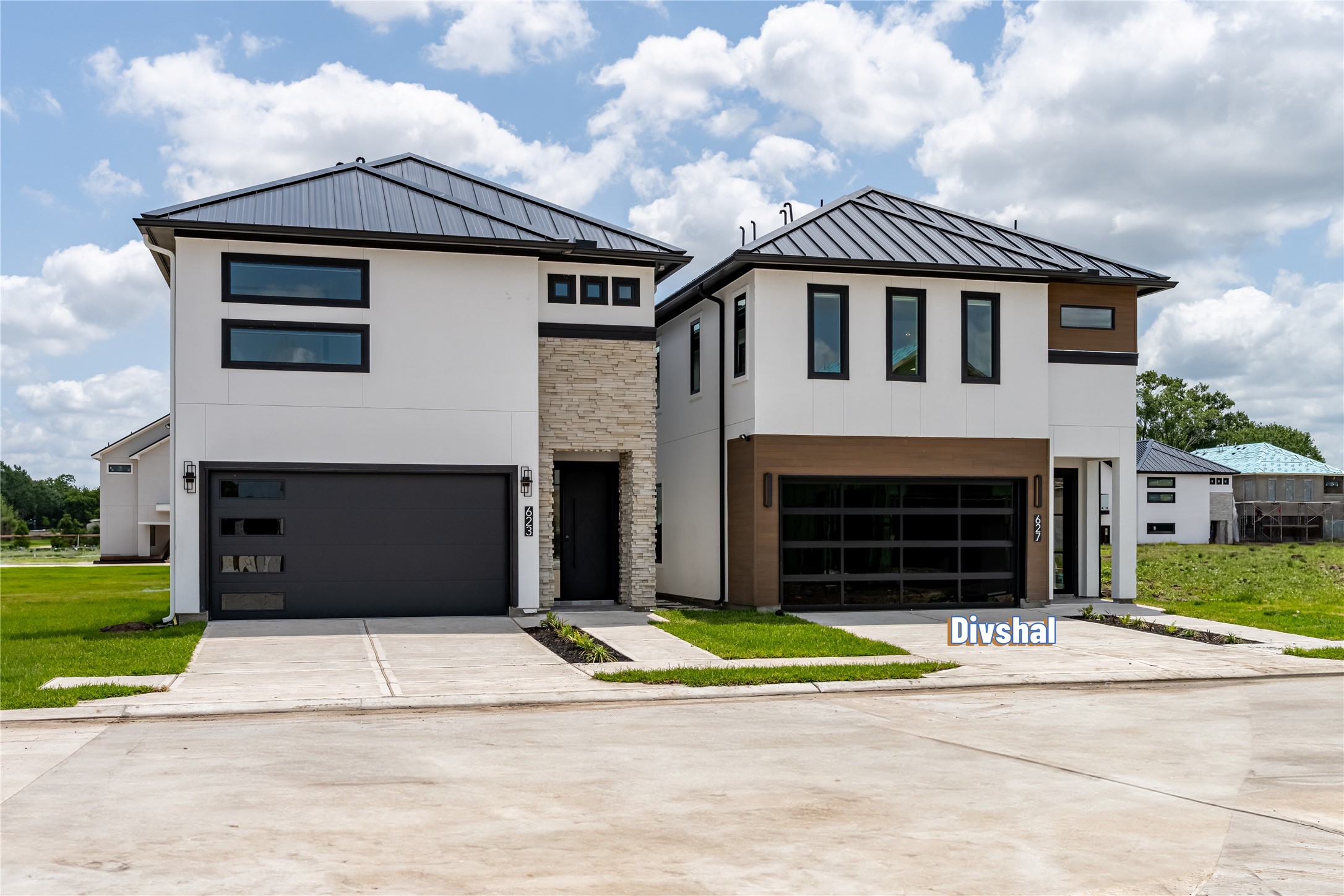 623 Rolling Oaks Stafford, TX 77477 - Photo 1 of 50 Grand curb appeal sets the tone for this architectural masterpiece by Shree Homes, featuring a stunning modern stucco façade complemented by premium composite decking accents