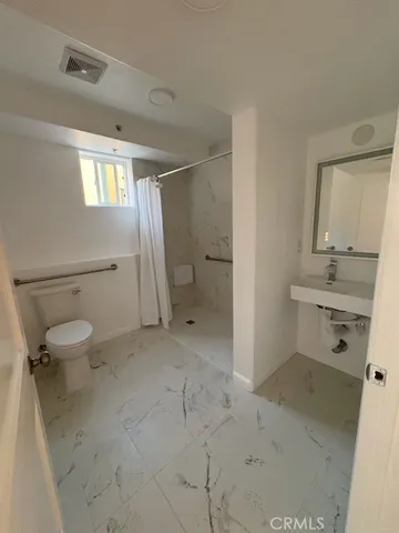 a view of a building with sitting area