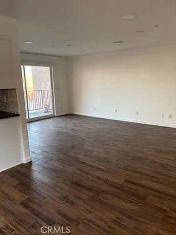a view of a livingroom with wooden floor