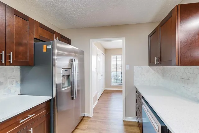 a view of n empty room with a window