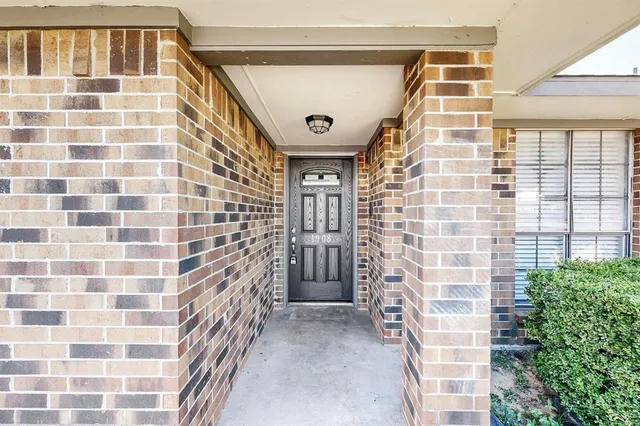 a view of front door of house with a outdoor space
