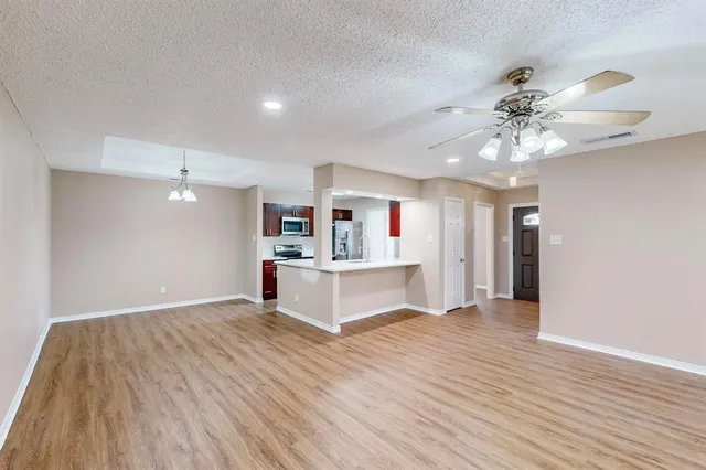 a view of a kitchen with microwave and cabinets