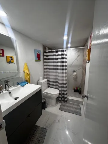 a view of a livingroom with furniture and windows