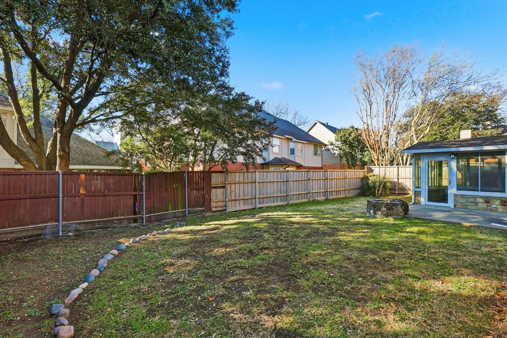5023 Falcon Hollow Road McKinney, TX 75072 - Photo 25 of 25 Fenced backyard featuring a sunroom