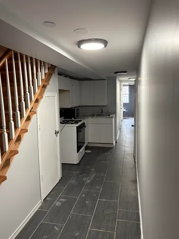 a view of a kitchen with a sink and dishwasher in a kitchen