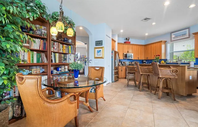 a bedroom with a bed and a flat tv screen on a dresser