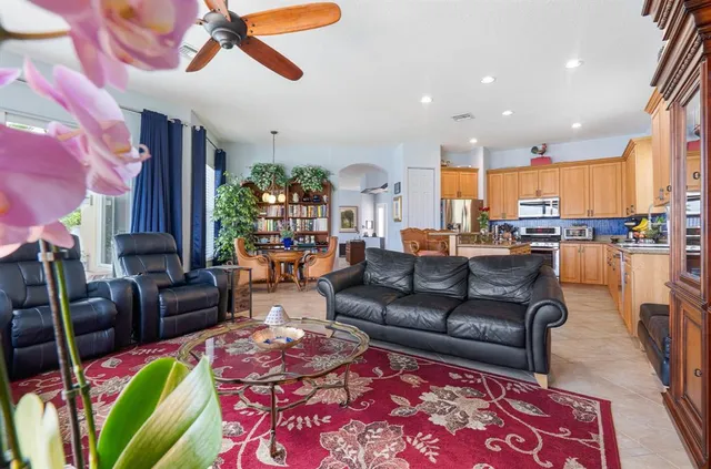 a bedroom with a bed and a dresser next to a window
