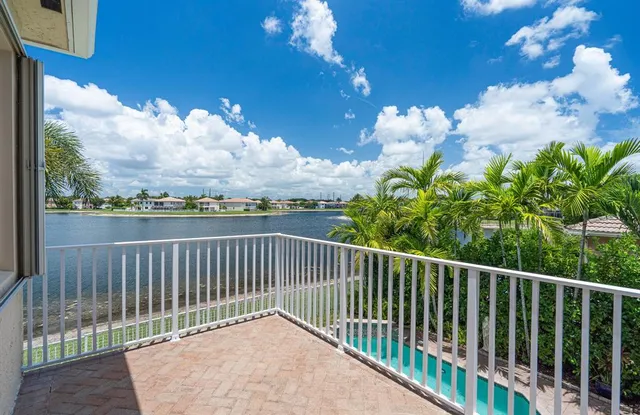 a living room with furniture a ceiling fan and a rug