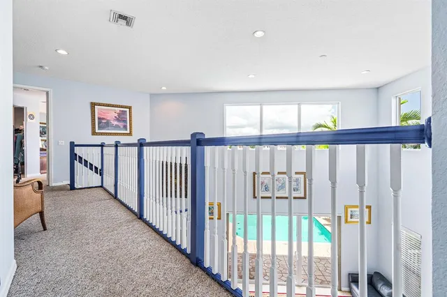 an aerial view of a house with a lake view