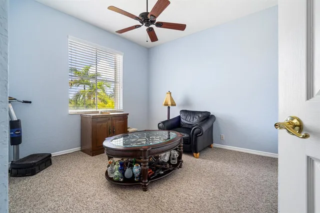 a view of a house with a swimming pool and a yard
