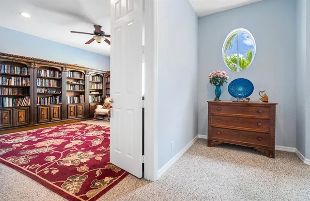 a view of a backyard with swimming pool