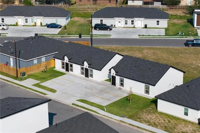 an aerial view of a house with a garden