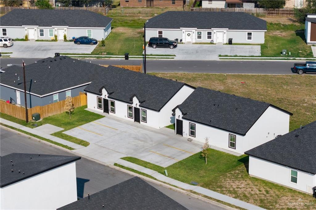 an aerial view of a house with a garden