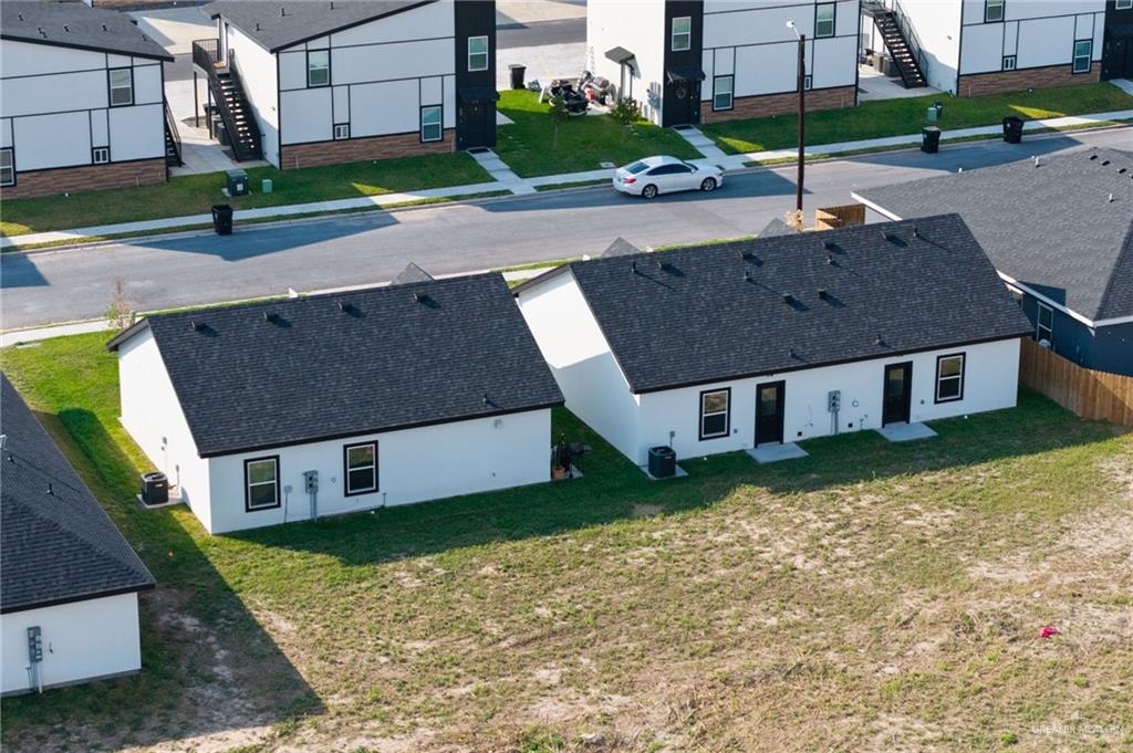 905 Crestview Street Weslaco, TX 78596 - Photo 10 of 10 a aerial view of a house with a yard and a large tree