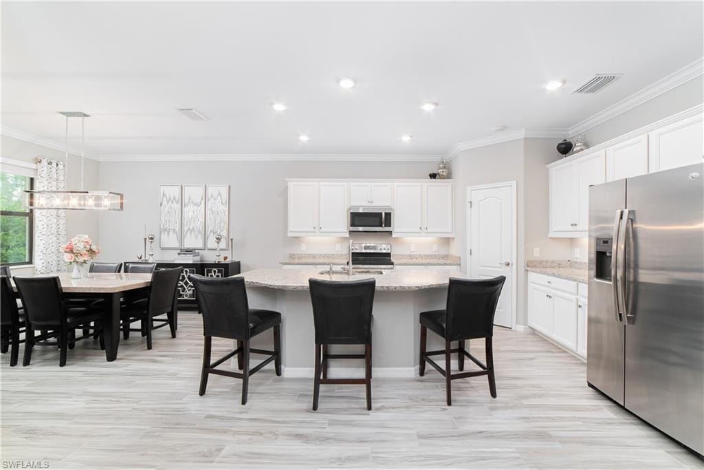 1654 Marton Court Naples, FL 34113 - Photo 4 of 29 Chef's delight - meal preparation at the island.