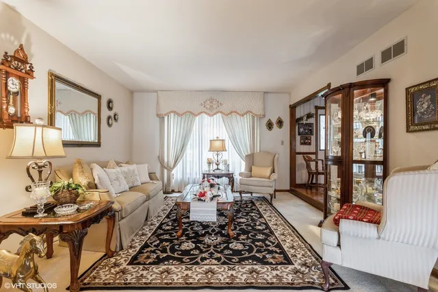 a living room with furniture and a rug