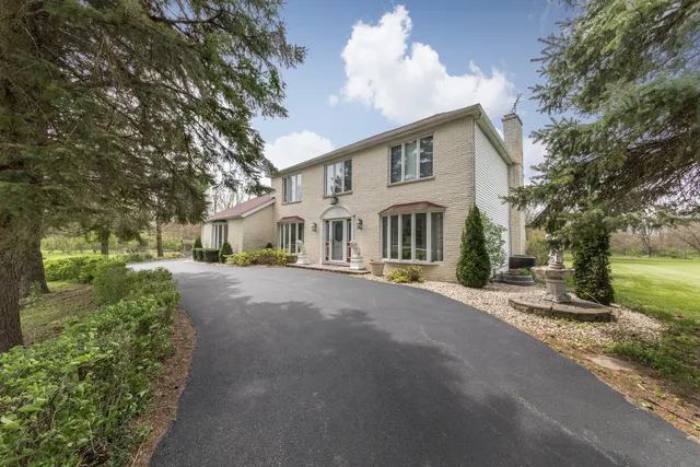 a view of a house with a street