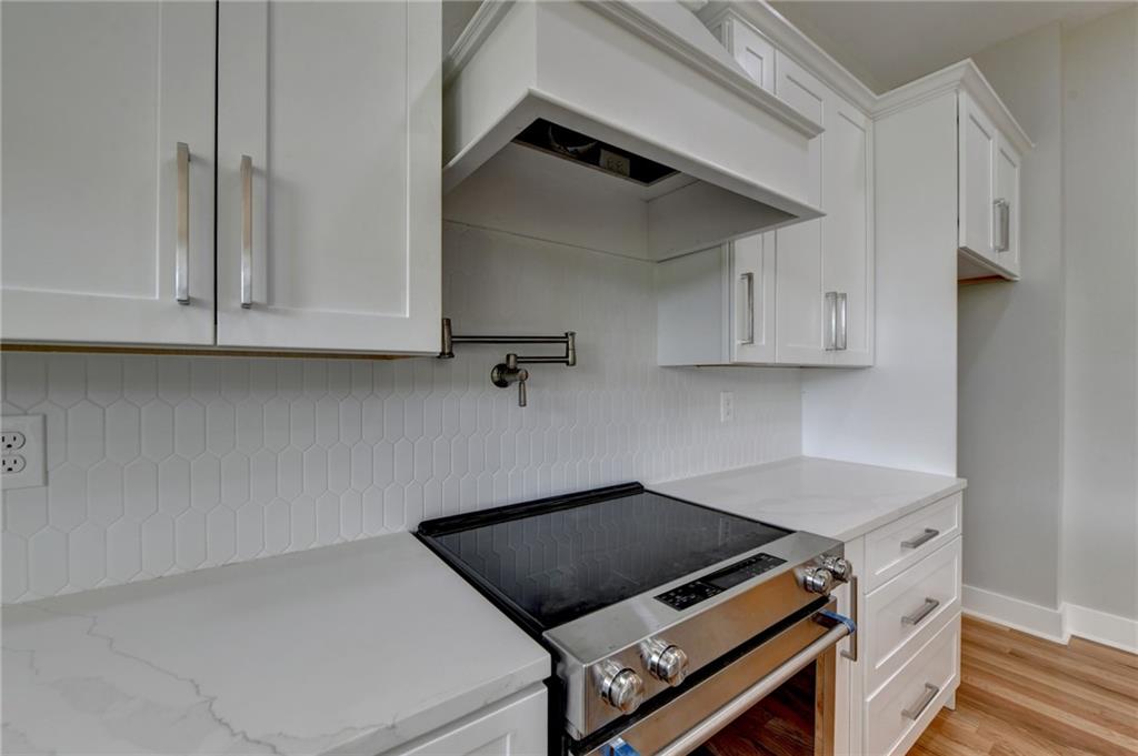 982 Wildberry Court Jefferson, GA 30549 - Photo 26 of 64 a stove top oven sitting inside of a kitchen