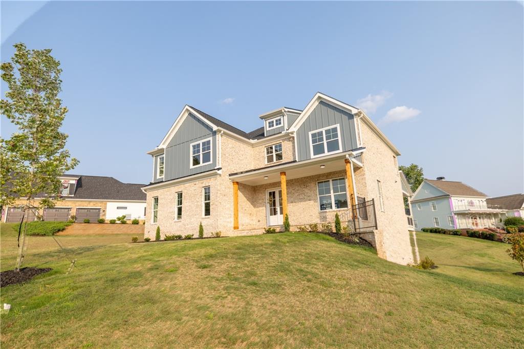 982 Wildberry Court Jefferson, GA 30549 - Photo 5 of 64 a front view of a house with a yard
