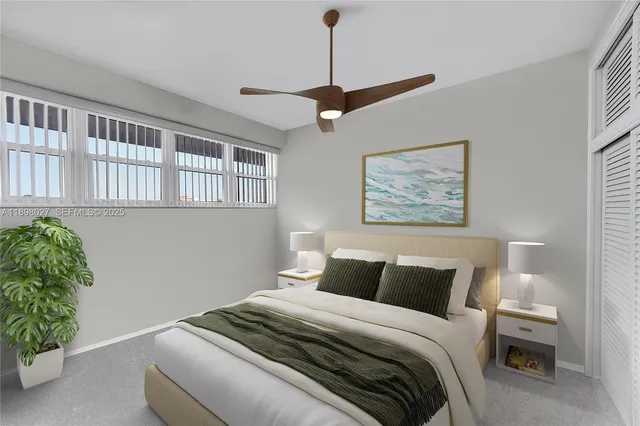 a bedroom with a bed and a potted plant