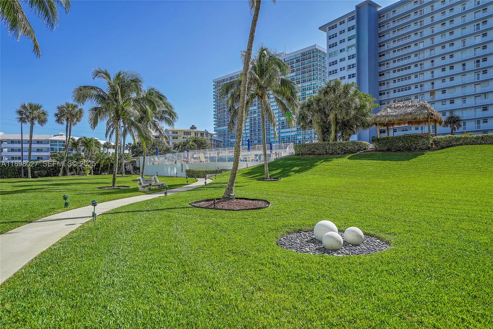 1900 South Ocean Drive, Unit 406 Fort Lauderdale, FL 33316 - Photo 21 of 26 a view of a golf course with a garden
