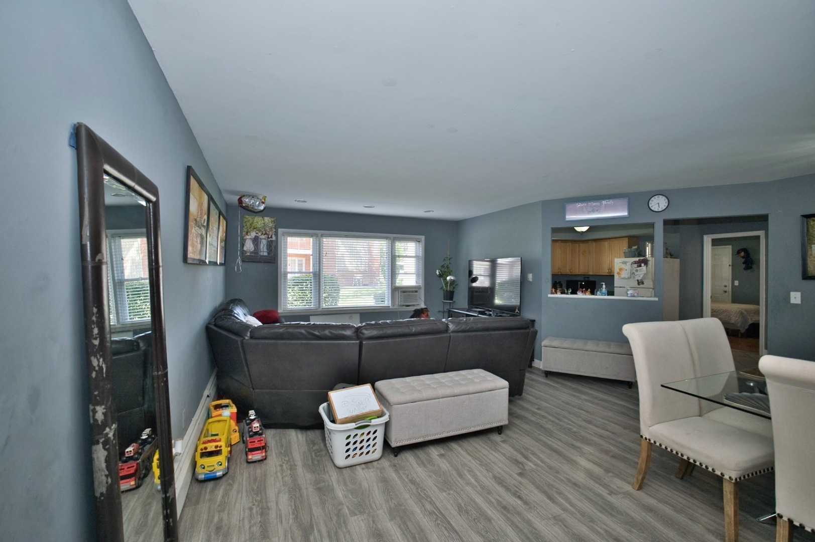 1111 East Algonquin Road, Unit 1 Arlington Heights, IL 60005 - Photo 11 of 42 a living room with furniture and a wooden floor