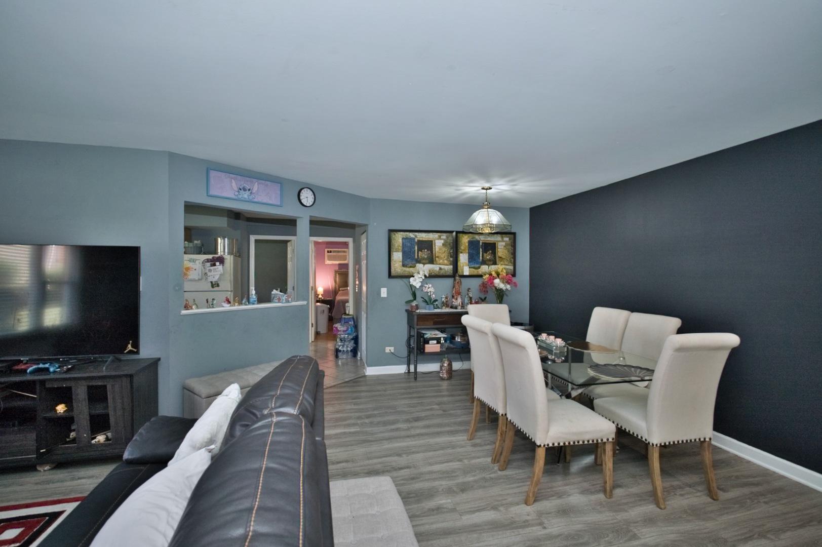 1111 East Algonquin Road, Unit 1 Arlington Heights, IL 60005 - Photo 16 of 42 a dining room with furniture and wooden floor