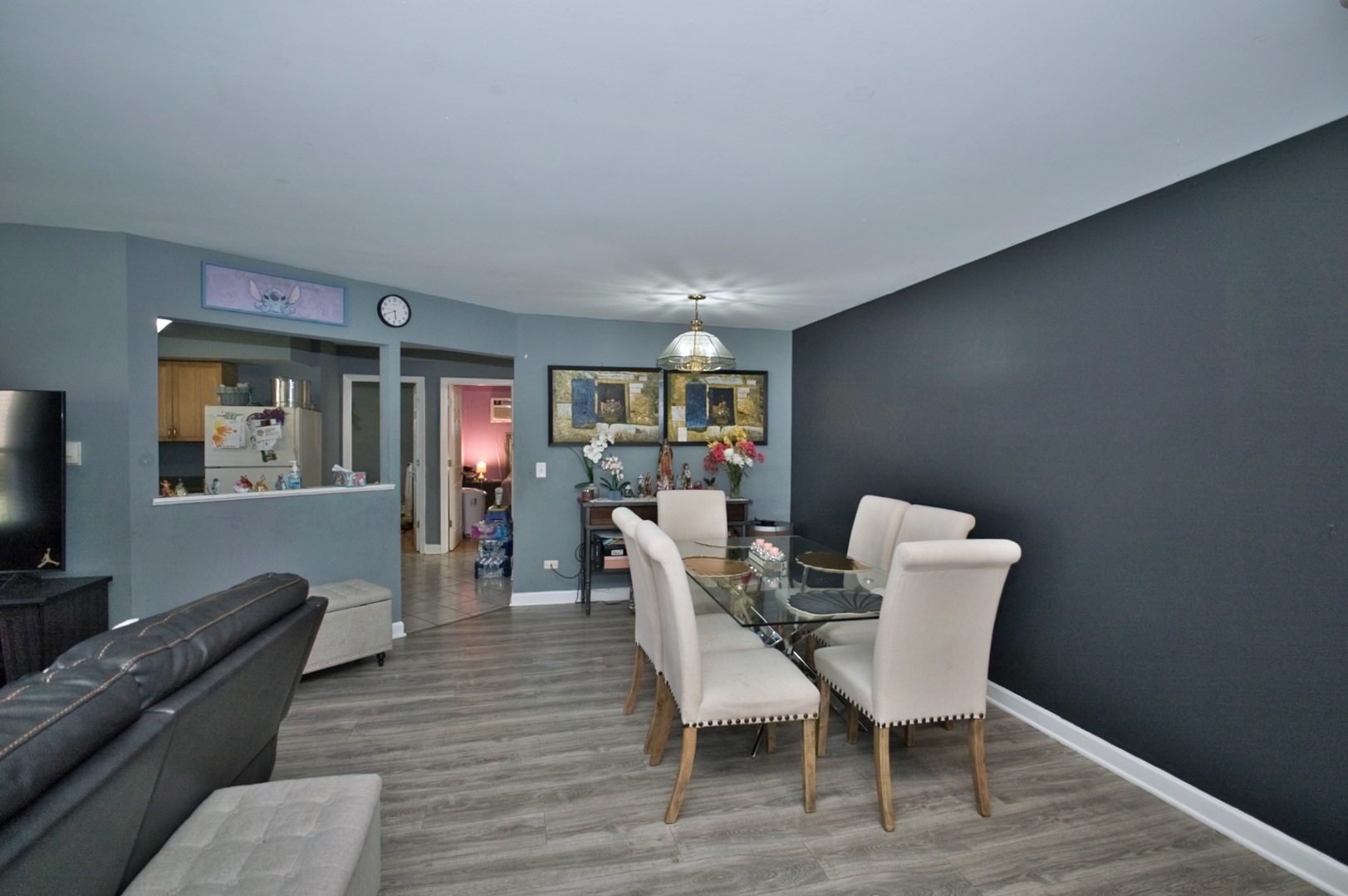 1111 East Algonquin Road, Unit 1 Arlington Heights, IL 60005 - Photo 17 of 42 a dining room with furniture and wooden floor