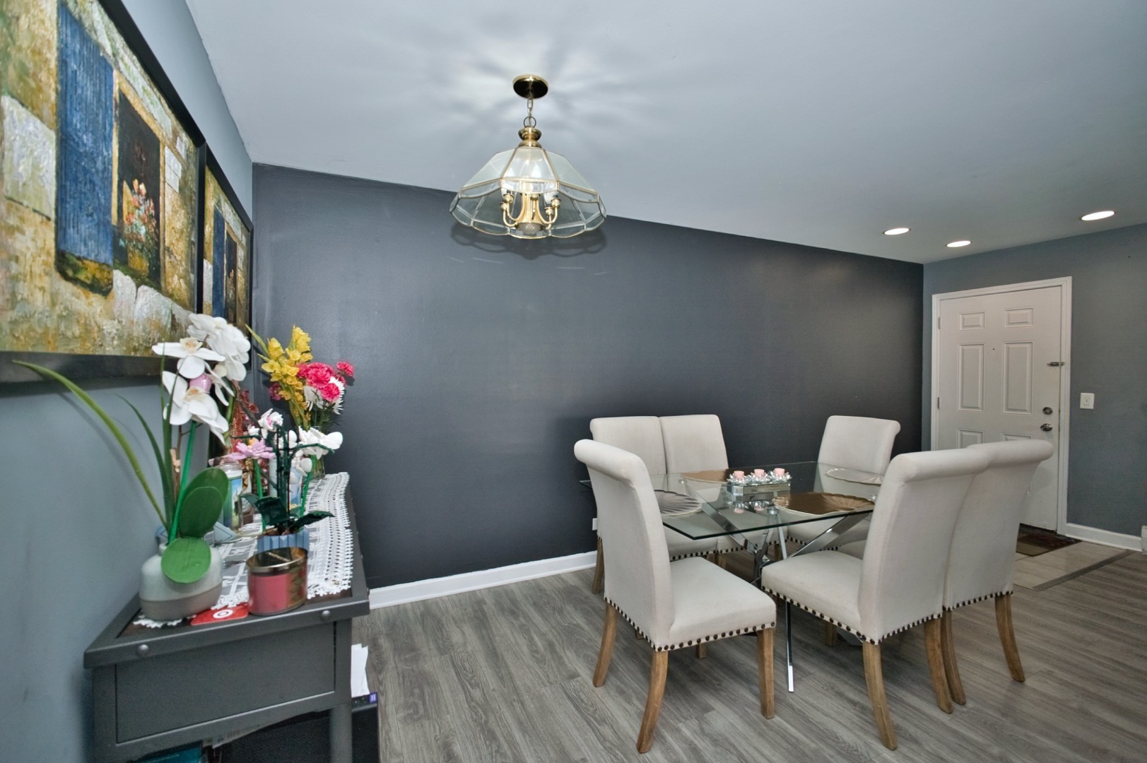 1111 East Algonquin Road, Unit 1 Arlington Heights, IL 60005 - Photo 18 of 42 a view of a dining room with furniture and wooden floor