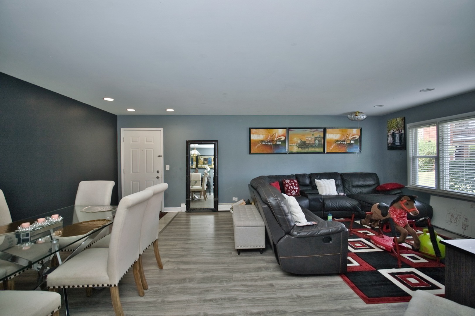 1111 East Algonquin Road, Unit 1 Arlington Heights, IL 60005 - Photo 20 of 42 a living room with furniture and a flat screen tv with wooden floor