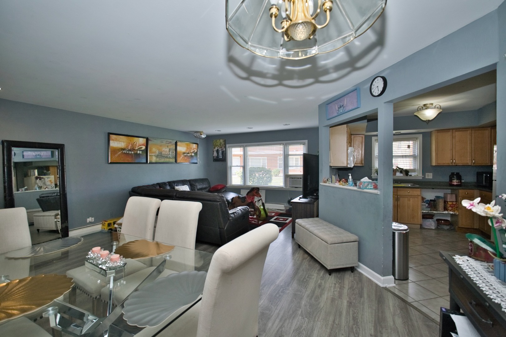 1111 East Algonquin Road, Unit 1 Arlington Heights, IL 60005 - Photo 22 of 42 a living room with furniture or chandelier and a wooden floor