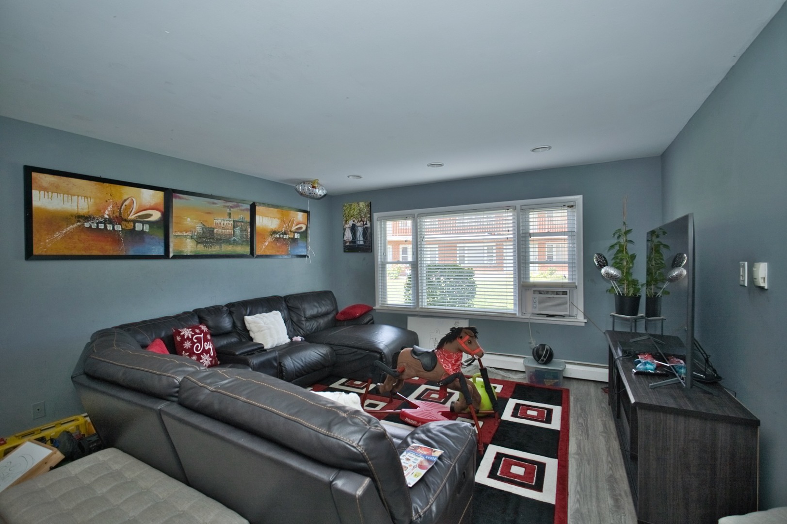 1111 East Algonquin Road, Unit 1 Arlington Heights, IL 60005 - Photo 23 of 42 a living room with furniture and a window