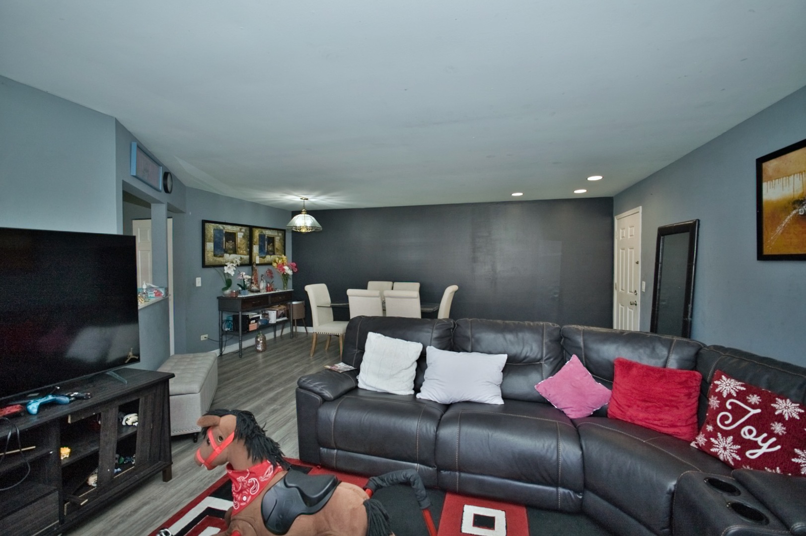 1111 East Algonquin Road, Unit 1 Arlington Heights, IL 60005 - Photo 24 of 42 a living room with furniture and a flat screen tv