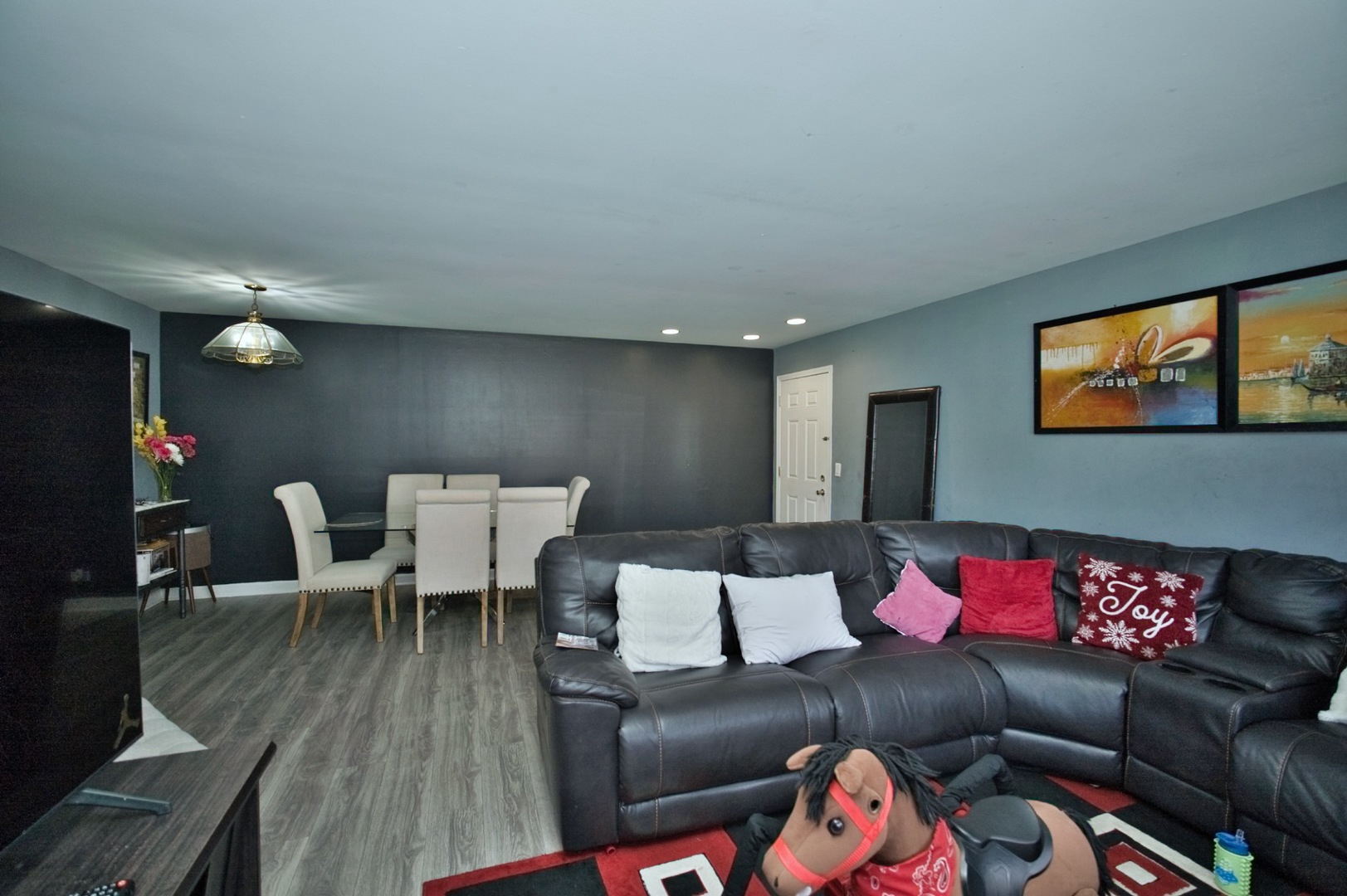 1111 East Algonquin Road, Unit 1 Arlington Heights, IL 60005 - Photo 25 of 42 a living room with furniture and a flat screen tv